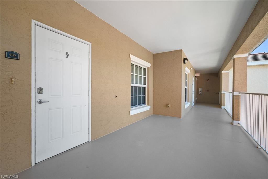 4455 Botanical Pl Circle, Unit 405 Naples, FL 34112 - Photo 46 of 46 a view of a big room with closet and windows