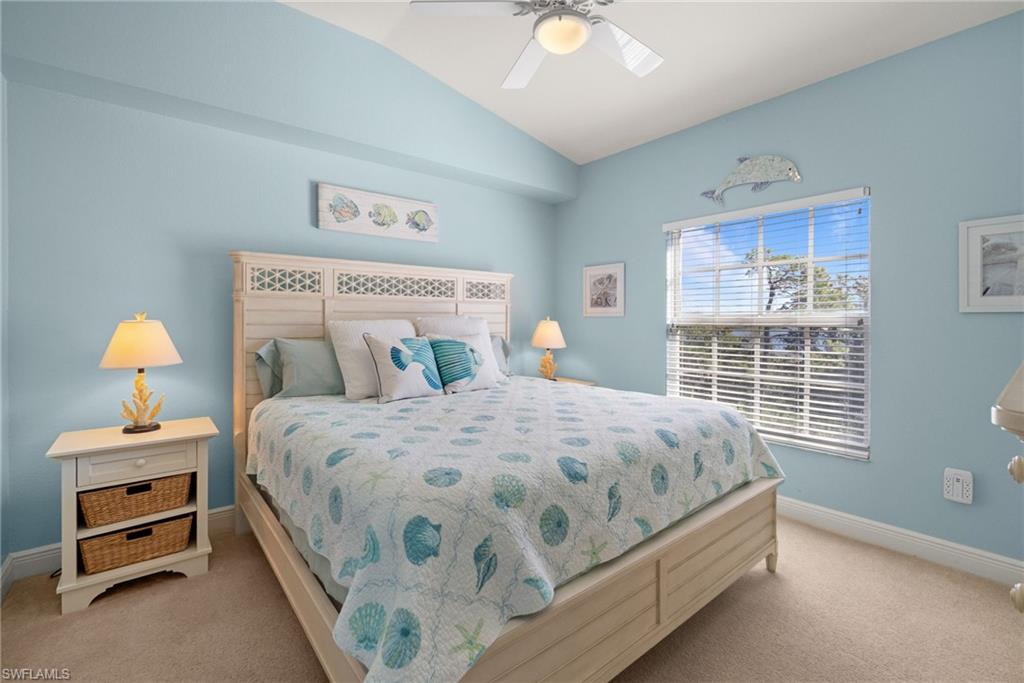 4455 Botanical Pl Circle, Unit 405 Naples, FL 34112 - Photo 7 of 46 a bedroom with a bed and a window