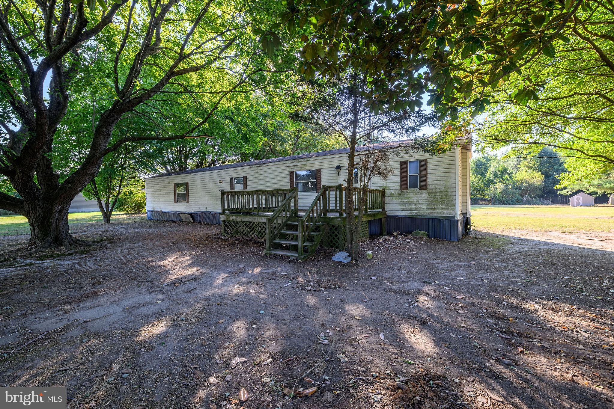 3182 Gun And Rod Club Road Houston, DE 19954 - Photo 13 of 32 a view of a house with backyard and a tree