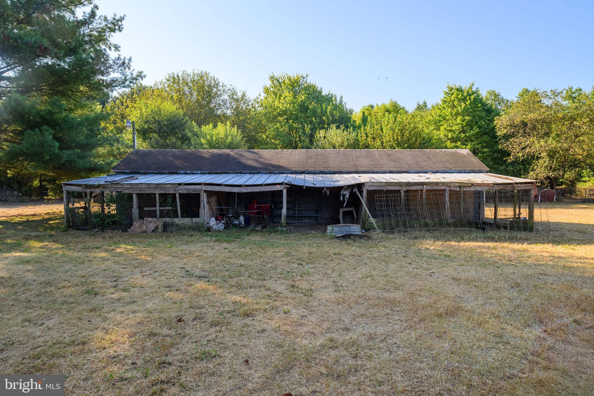 3182 Gun And Rod Club Road Houston, DE 19954 - Photo 16 of 32 a backyard of a house with table and chairs