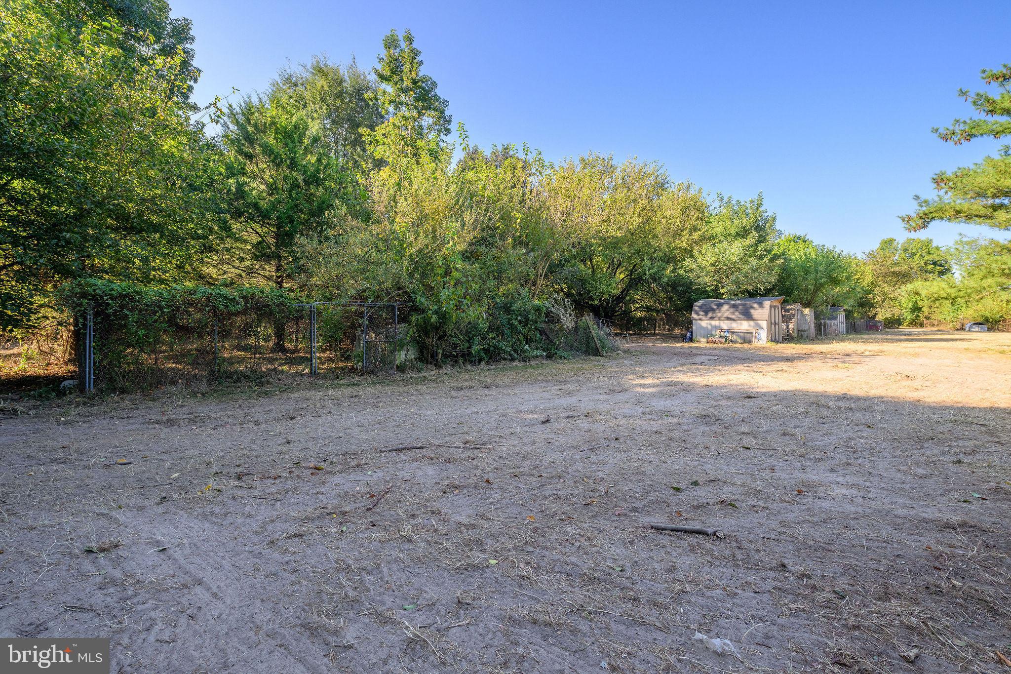 3182 Gun And Rod Club Road Houston, DE 19954 - Photo 20 of 32 a view of a dirt road with trees in the background