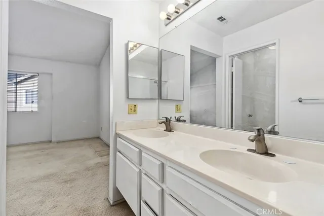 a bathroom with a bath tub with a shower