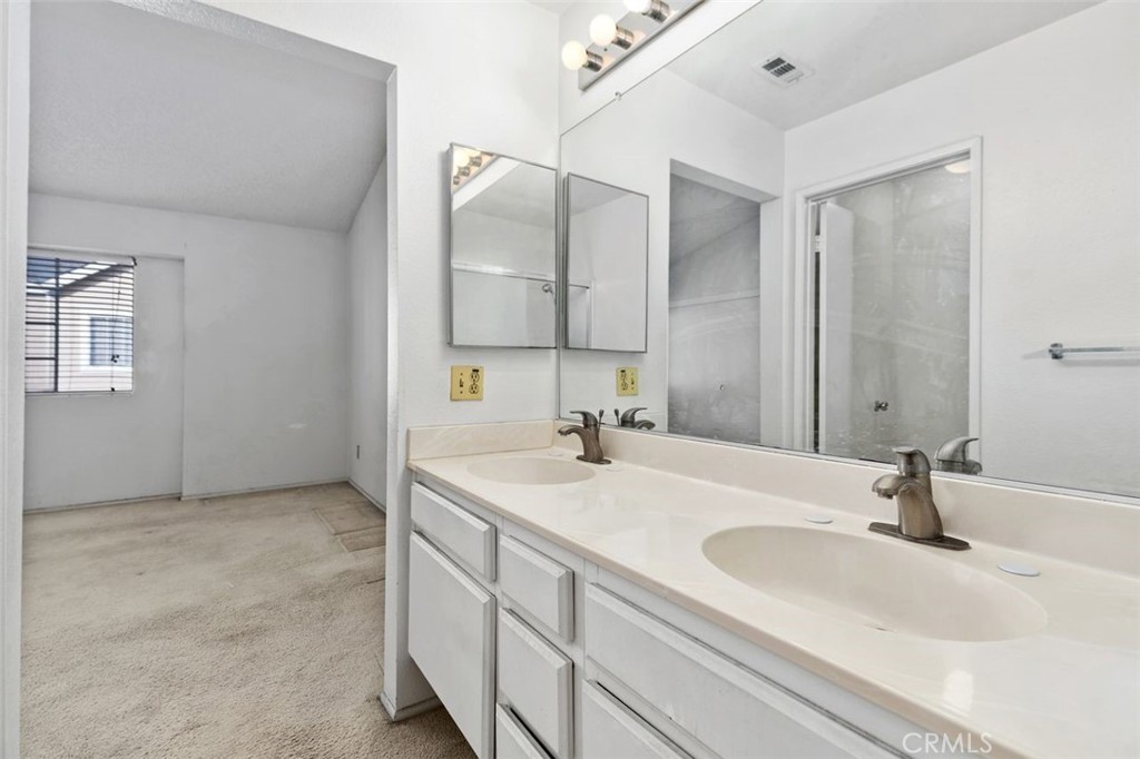 2800 Plaza Del Amo, Unit 375 Torrance, CA 90503 - Photo 17 of 24 a bathroom with a sink and a mirror