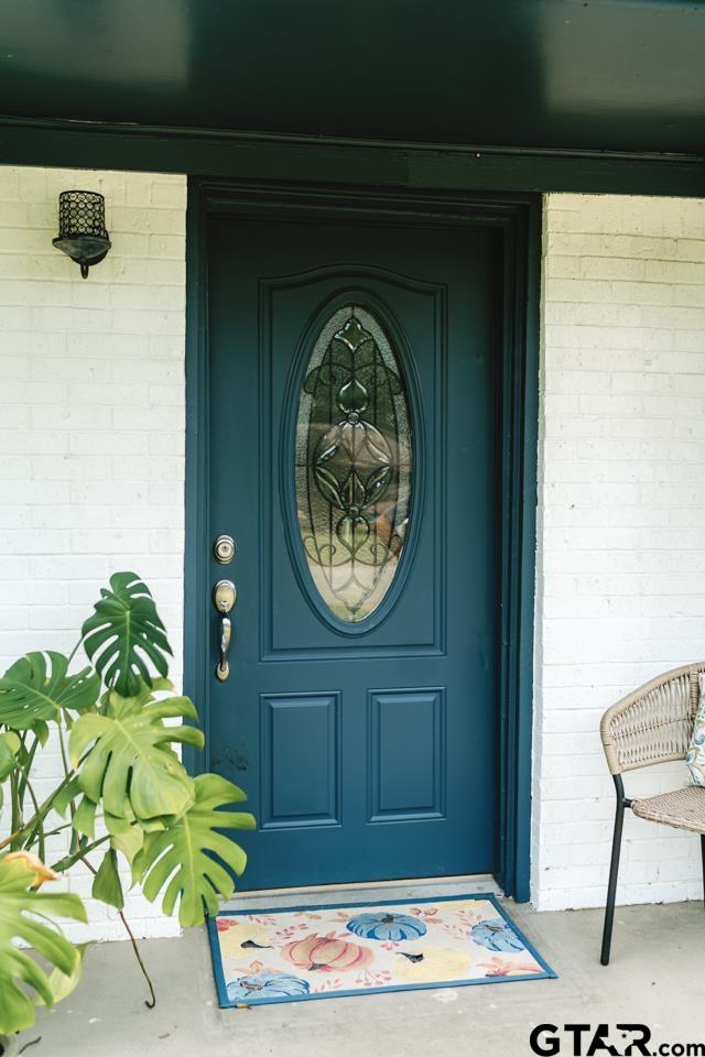 2411 Rodge Drive Tyler, TX 75701 - Photo 2 of 42 a front view of a house with a garden