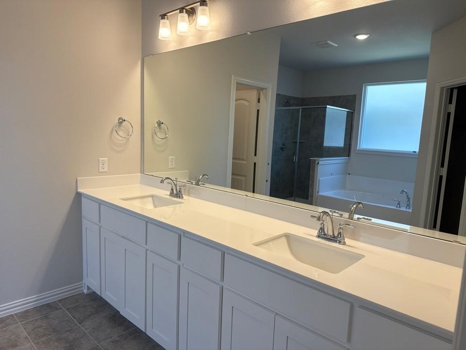 1325 Frio Drive Springtown, TX 76082 - Photo 7 of 10 a bathroom with double sink and a large mirror