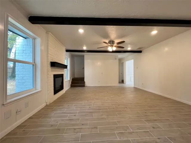 a kitchen with stainless steel appliances a refrigerator sink and microwave