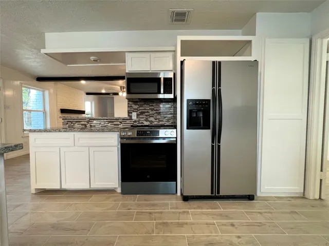 a bathroom with a sink a toilet and a bathtub