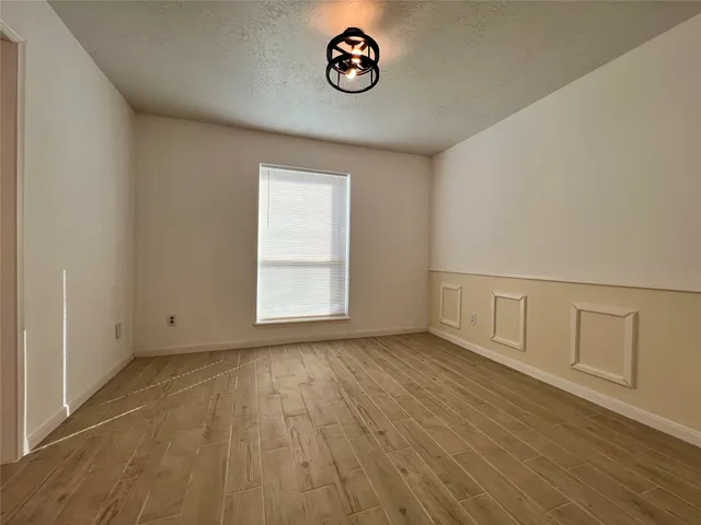 a room with window and a ceiling fan