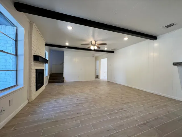 a kitchen with granite countertop a sink and a stove top oven