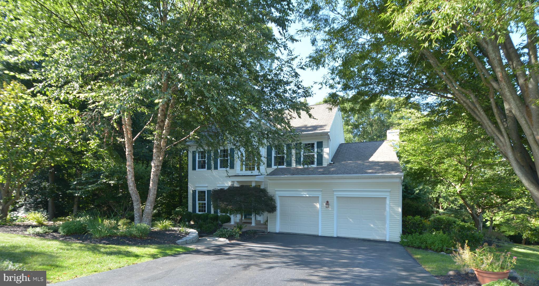 front view of a house with a tree