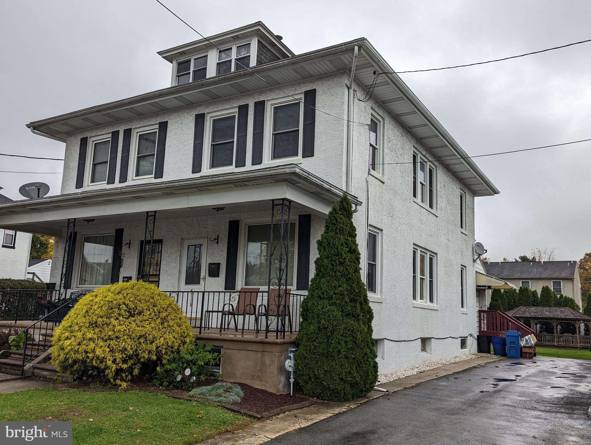 4715 Kutztown Road Temple, PA 19560 - Photo 1 of 28 a front view of a house with garden