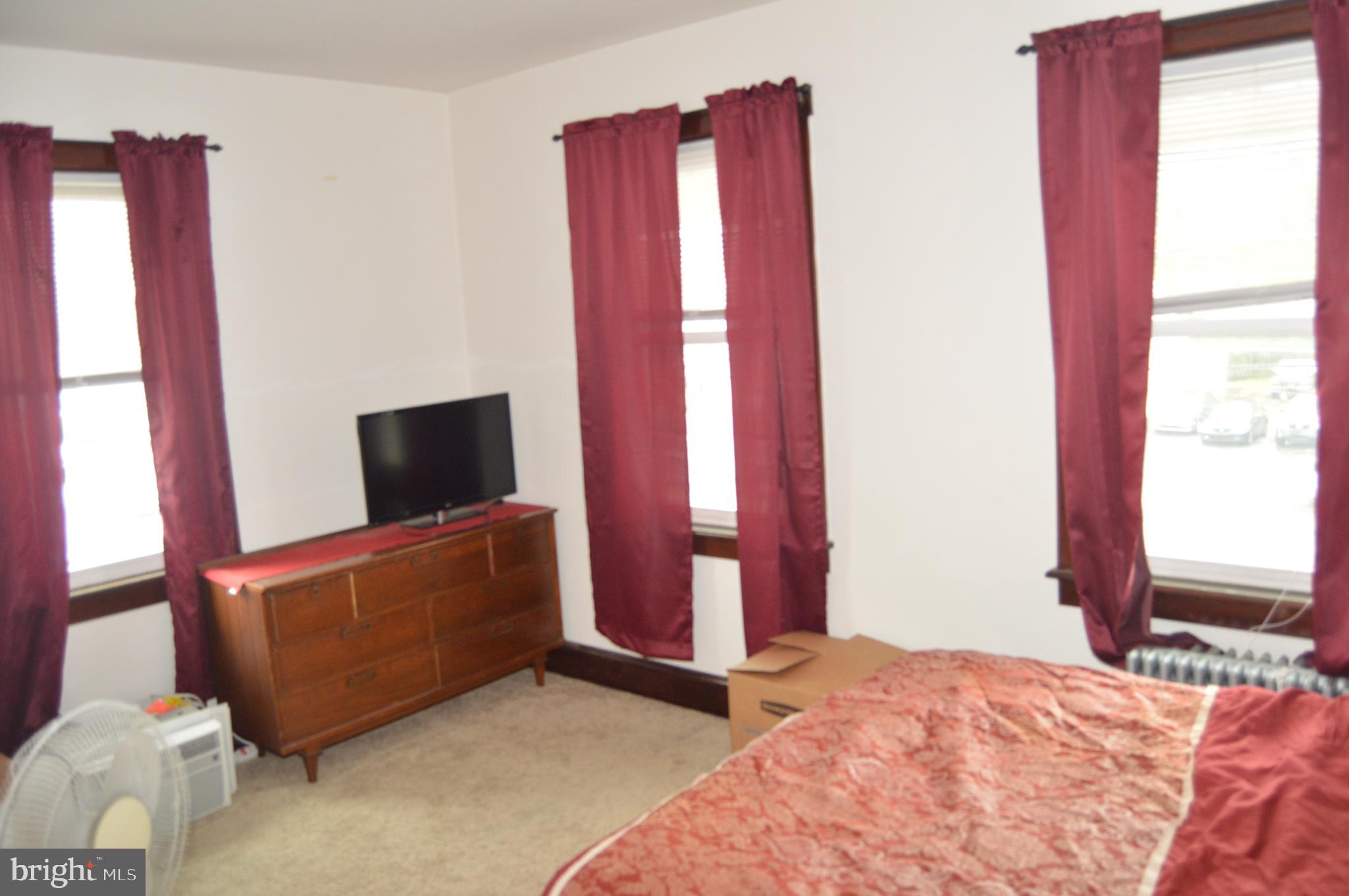 4715 Kutztown Road Temple, PA 19560 - Photo 11 of 28 a bedroom with a bed and a television