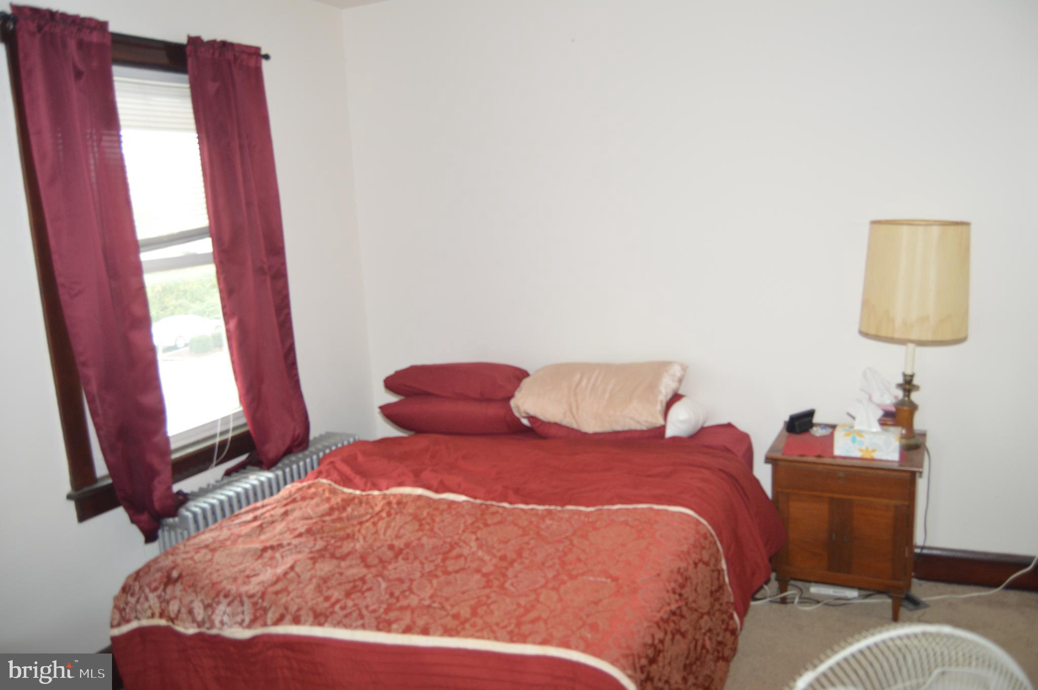 4715 Kutztown Road Temple, PA 19560 - Photo 12 of 28 a bedroom with a bed and a window