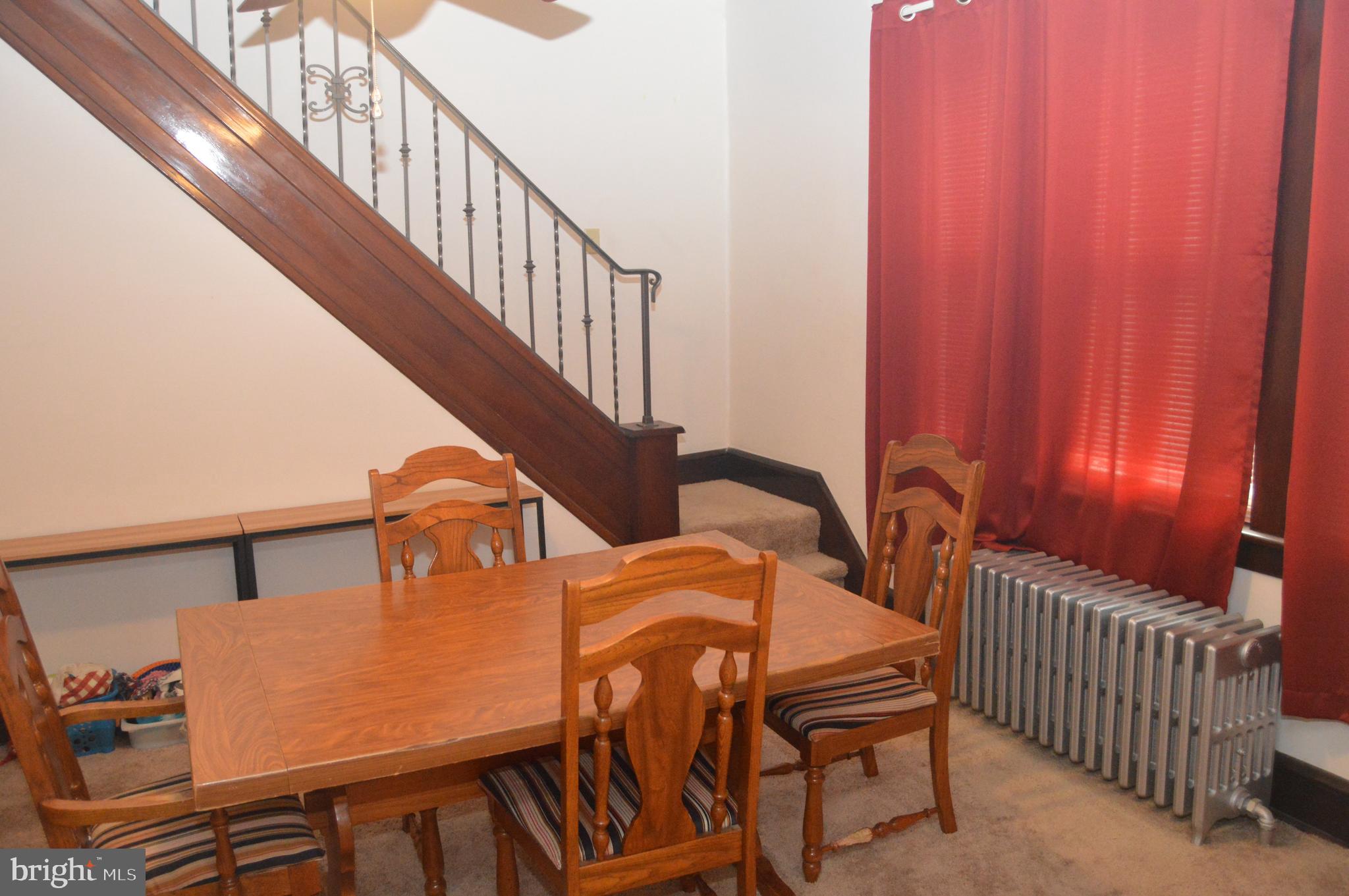 4715 Kutztown Road Temple, PA 19560 - Photo 4 of 28 a view of a dining room with furniture and chandelier