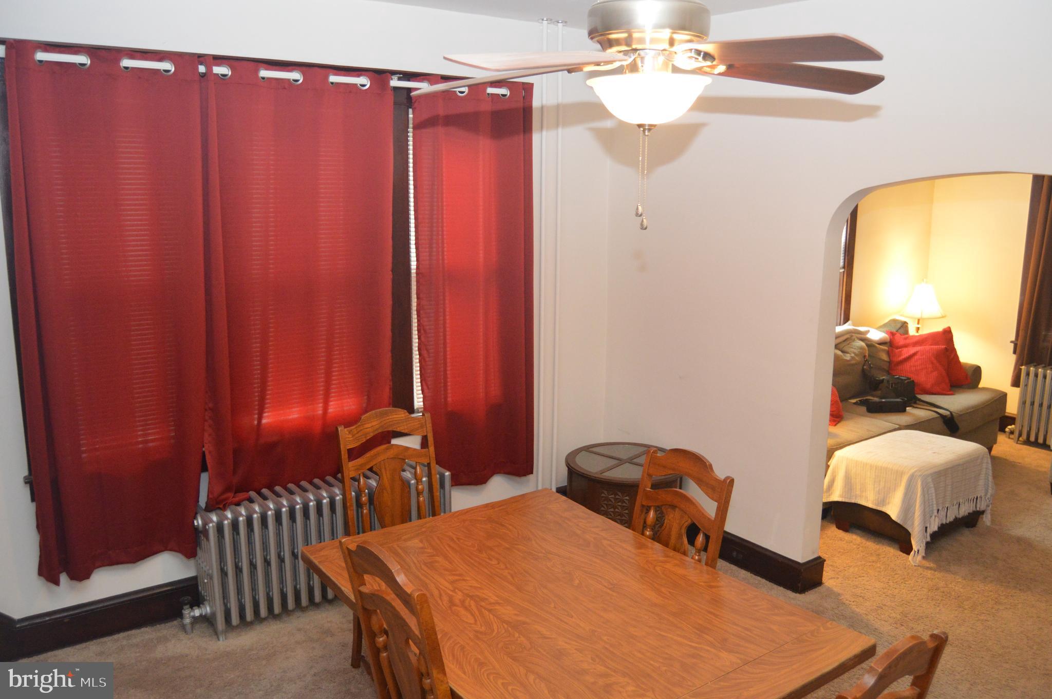 4715 Kutztown Road Temple, PA 19560 - Photo 6 of 28 a bedroom with bed and a chandelier