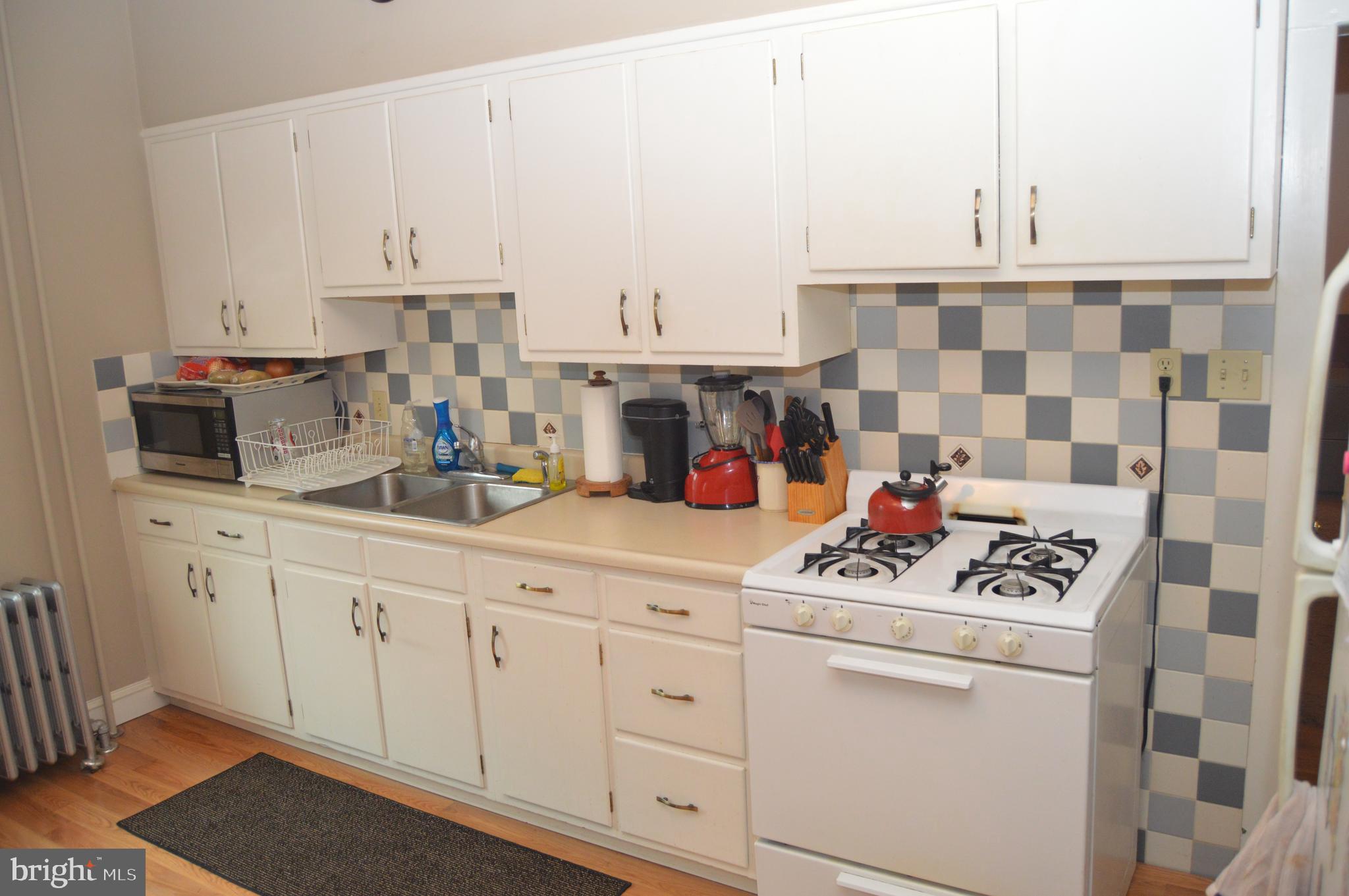 4715 Kutztown Road Temple, PA 19560 - Photo 9 of 28 a kitchen with appliances cabinets and a counter top