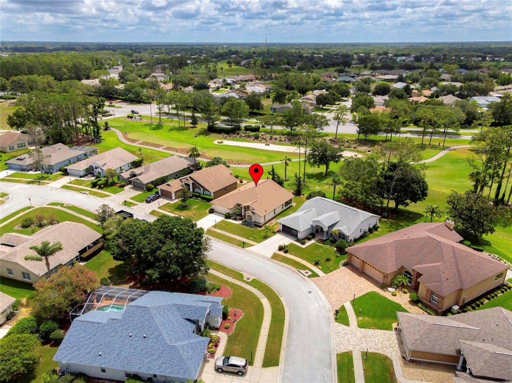 11228 Windrush Circle Hudson, FL 34667 - Photo 2 of 67 an aerial view of residential houses with outdoor space