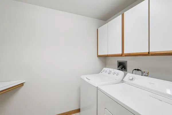 a view of storage and utility room with racks on the wall