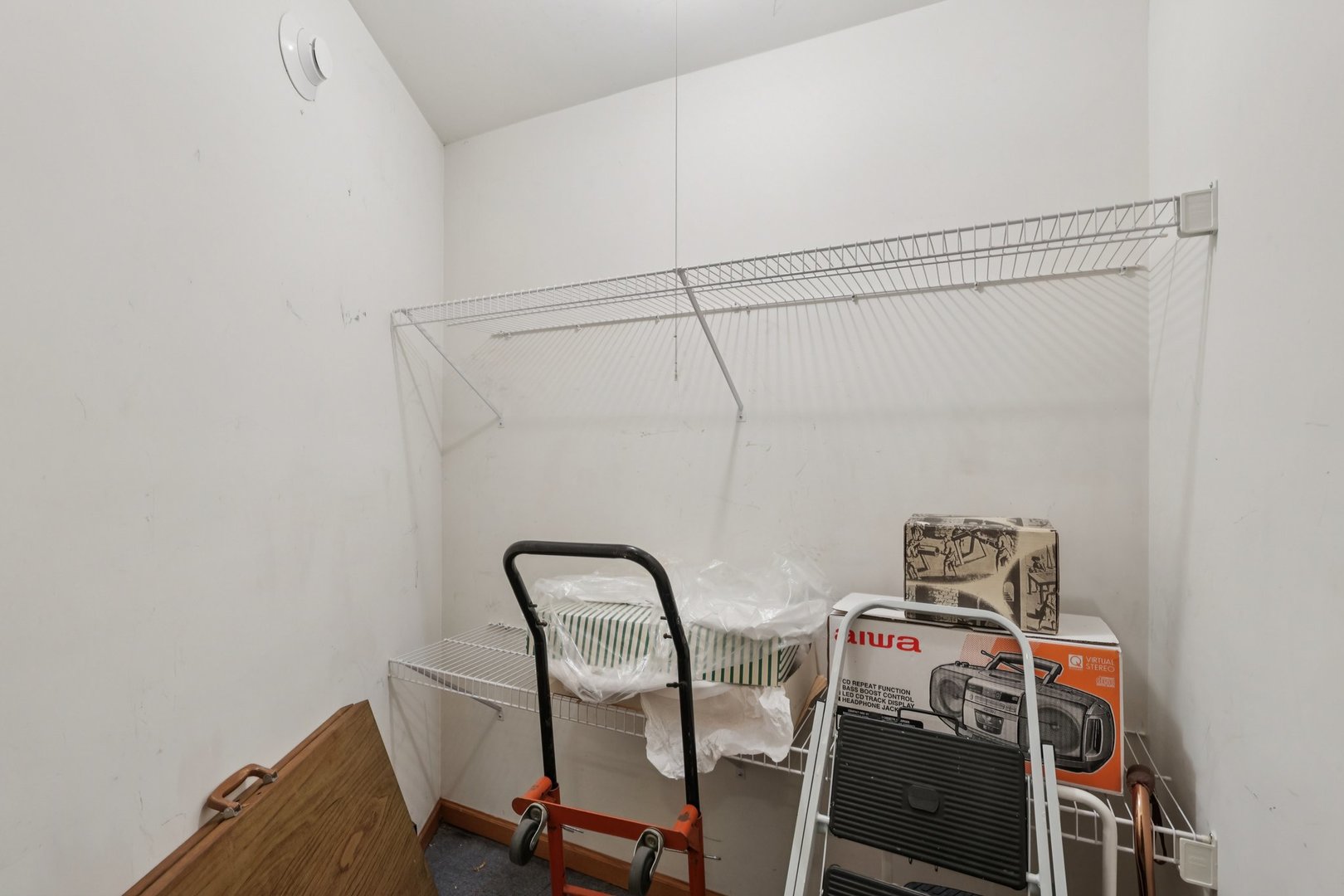 7450 North Waukegan Road, Unit 505 Niles, IL 60714 - Photo 26 of 30 a view of storage and utility room with racks on the wall