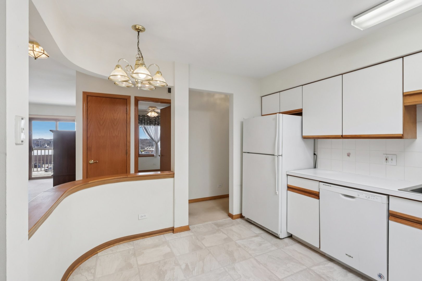7450 North Waukegan Road, Unit 505 Niles, IL 60714 - Photo 10 of 30 a view of kitchen with refrigerator and cabinets
