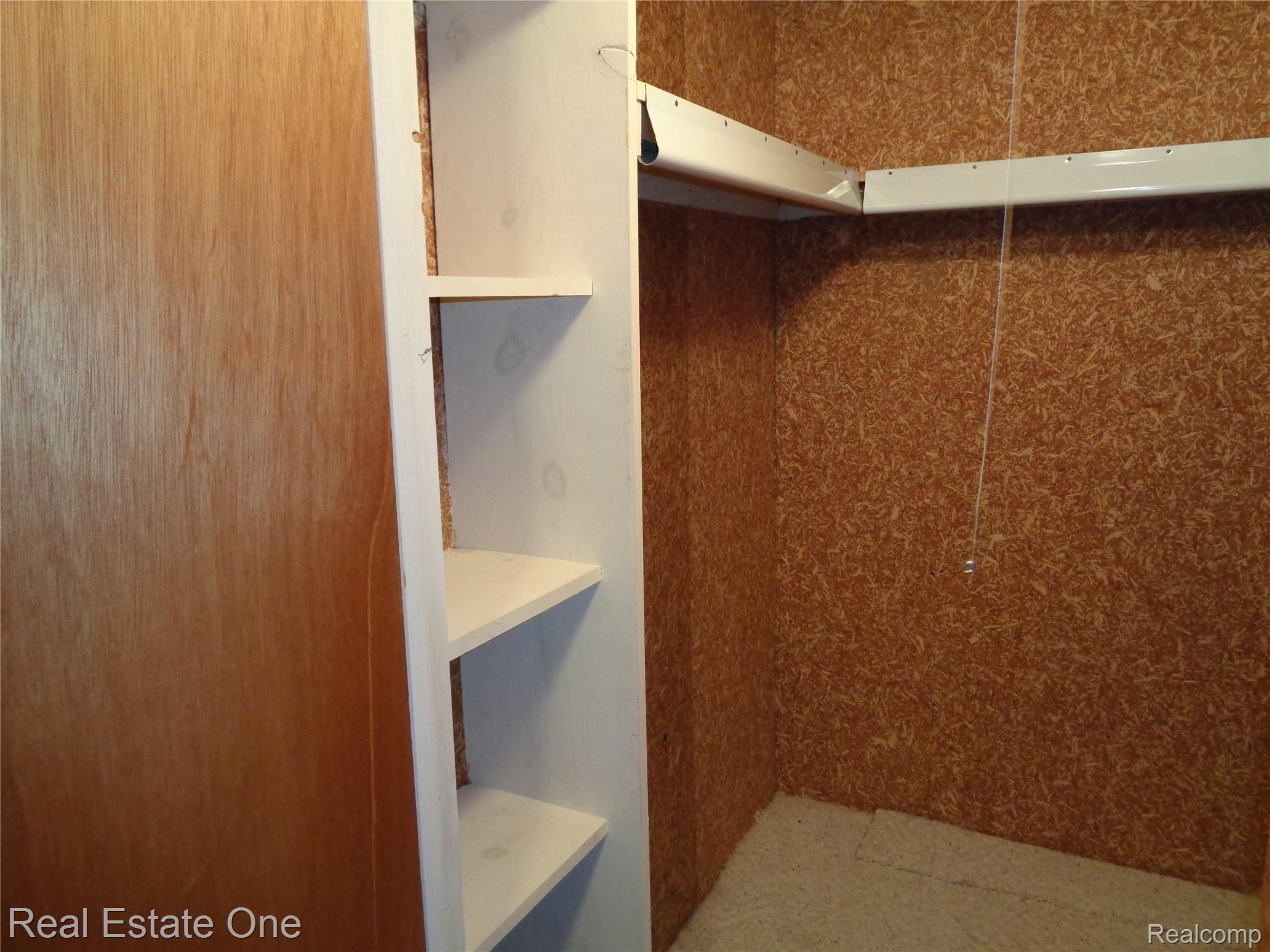 624 Tennyson, Unit 113 Rochester, MI 48307 - Photo 40 of 51 Lower level cedar closet