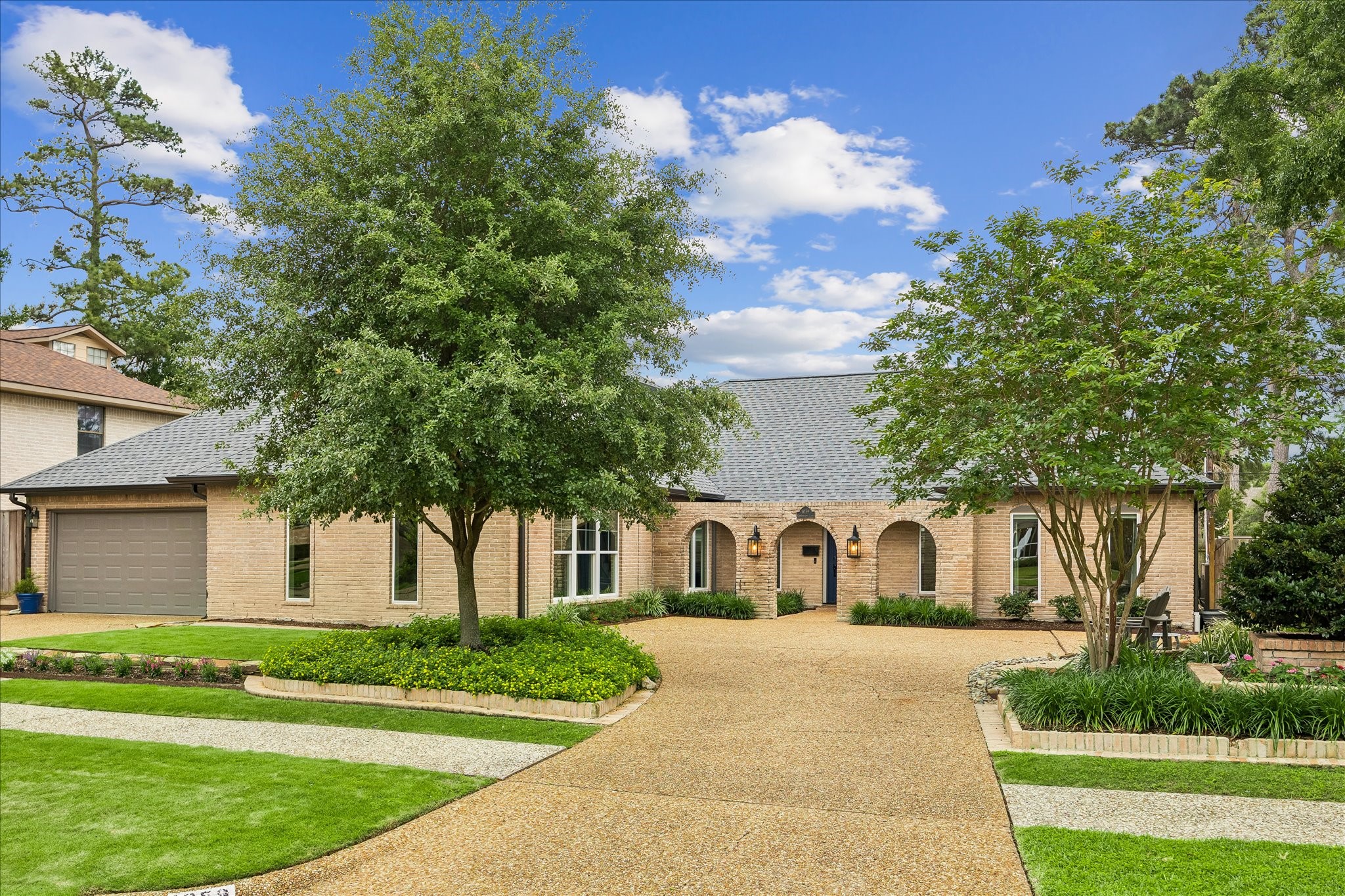 1059 Candlelight Lane Houston, TX 77018 - Photo 1 of 35 a front view of a house with garden