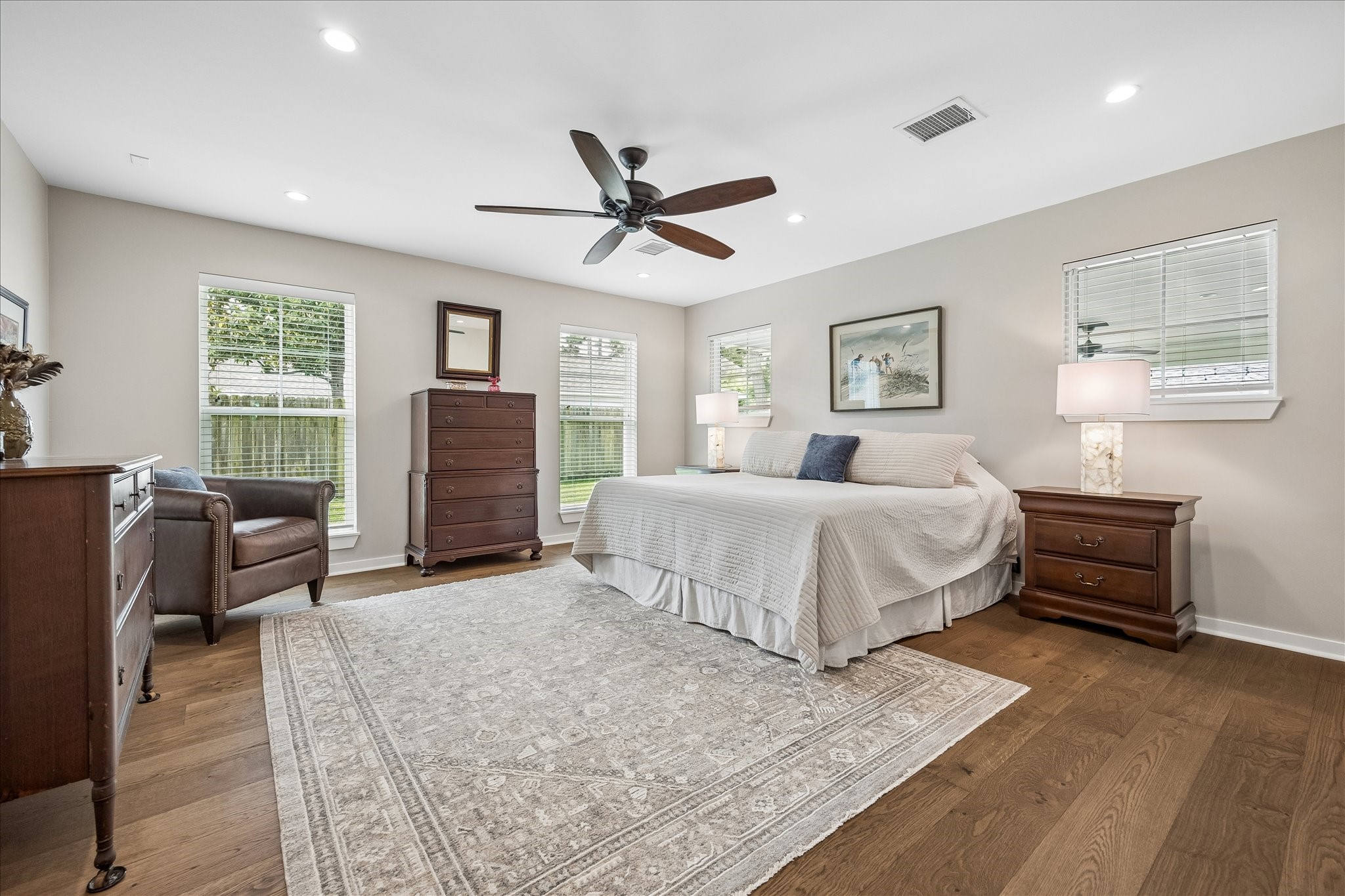 1059 Candlelight Lane Houston, TX 77018 - Photo 16 of 35 a bedroom with a bed and wooden floor