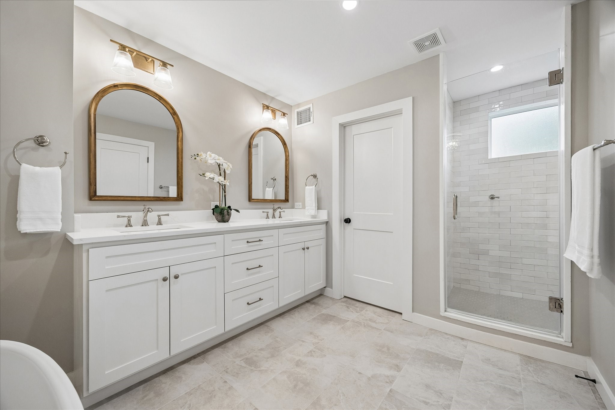 1059 Candlelight Lane Houston, TX 77018 - Photo 17 of 35 a spacious bathroom with a double vanity sink mirror and shower