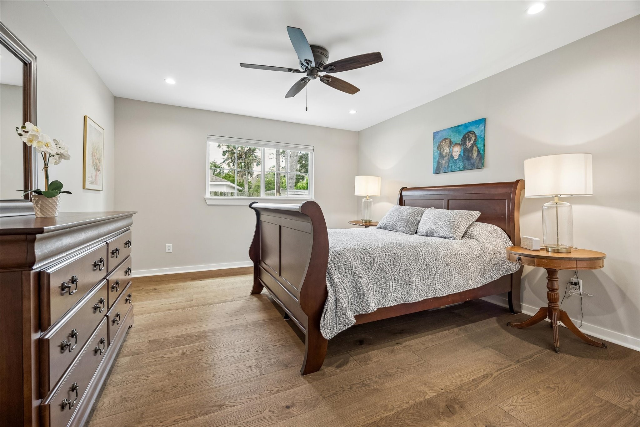 1059 Candlelight Lane Houston, TX 77018 - Photo 21 of 35 a spacious bedroom with a bed and a chandelier