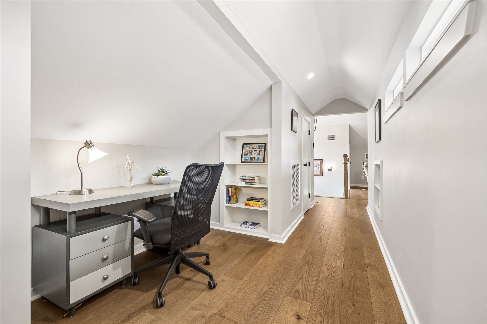 1059 Candlelight Lane Houston, TX 77018 - Photo 27 of 35 a view of a workspace with furniture and wooden floor