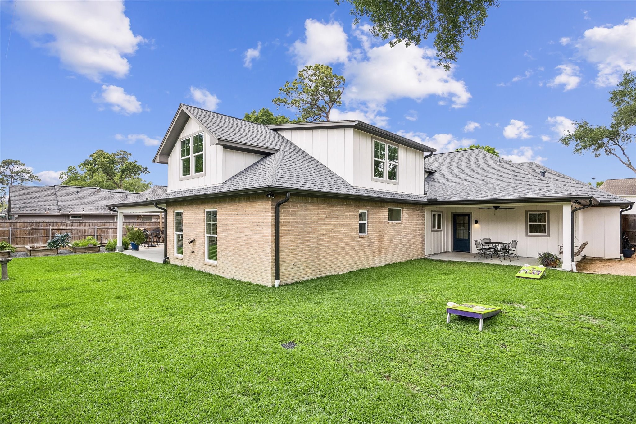 1059 Candlelight Lane Houston, TX 77018 - Photo 30 of 35 a view of a house with a yard and sitting area