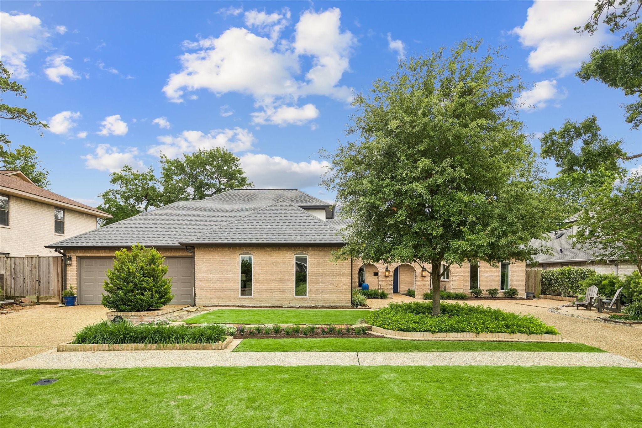 1059 Candlelight Lane Houston, TX 77018 - Photo 33 of 35 a front view of a house with a garden