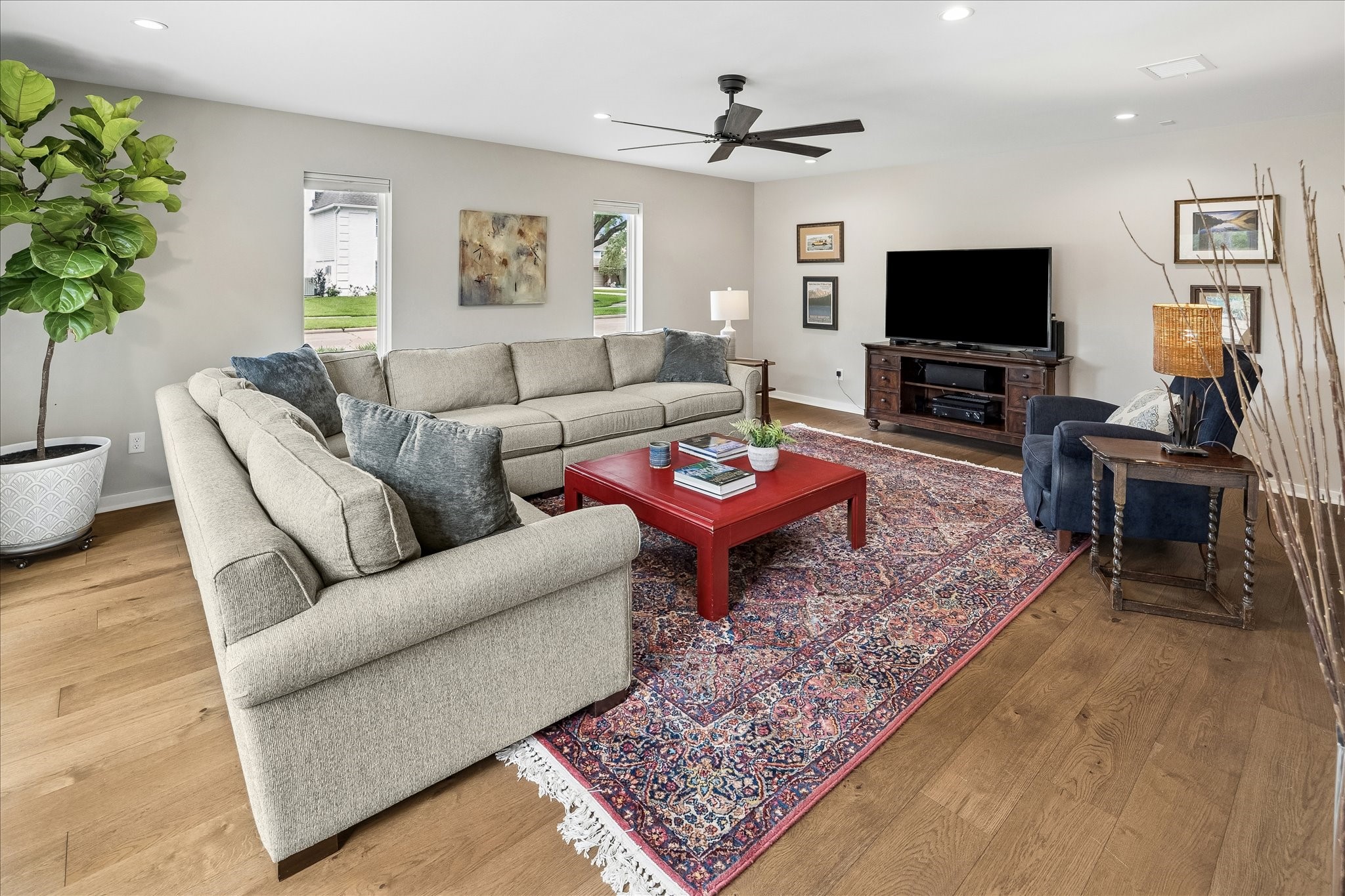1059 Candlelight Lane Houston, TX 77018 - Photo 5 of 35 a living room with furniture a rug and a flat screen tv