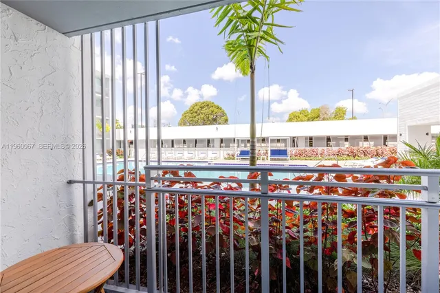 a view of swimming pool with outdoor seating