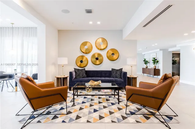 a living room with furniture and a rug