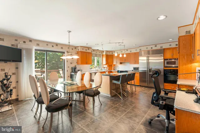 a view of a dining room with furniture window and outside view