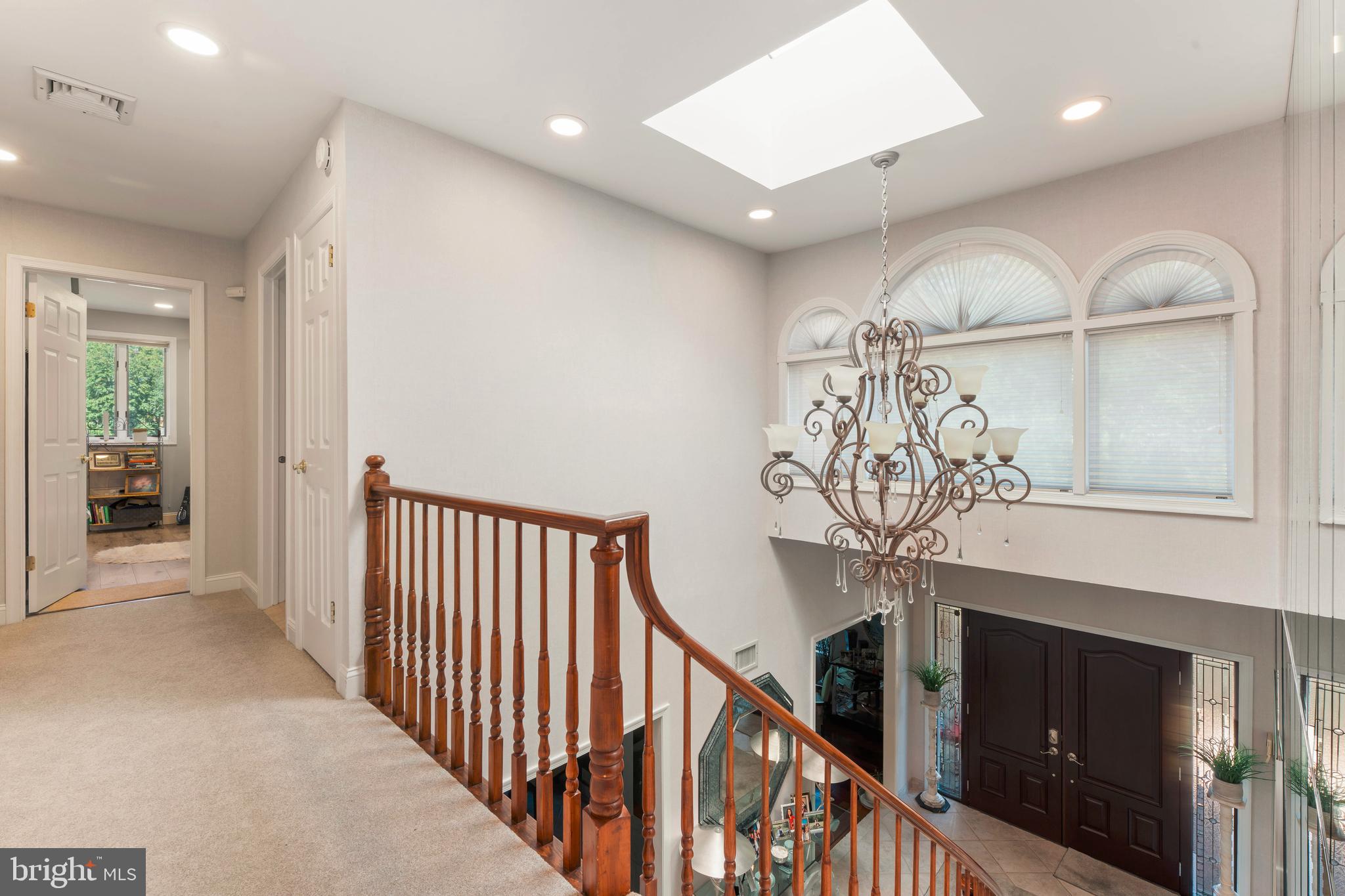 3843 Loop Road Huntingdon Valley, PA 19006 - Photo 22 of 51 a view of a livingroom with wooden floor and staircase