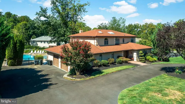 a view of a house with yard and a garden