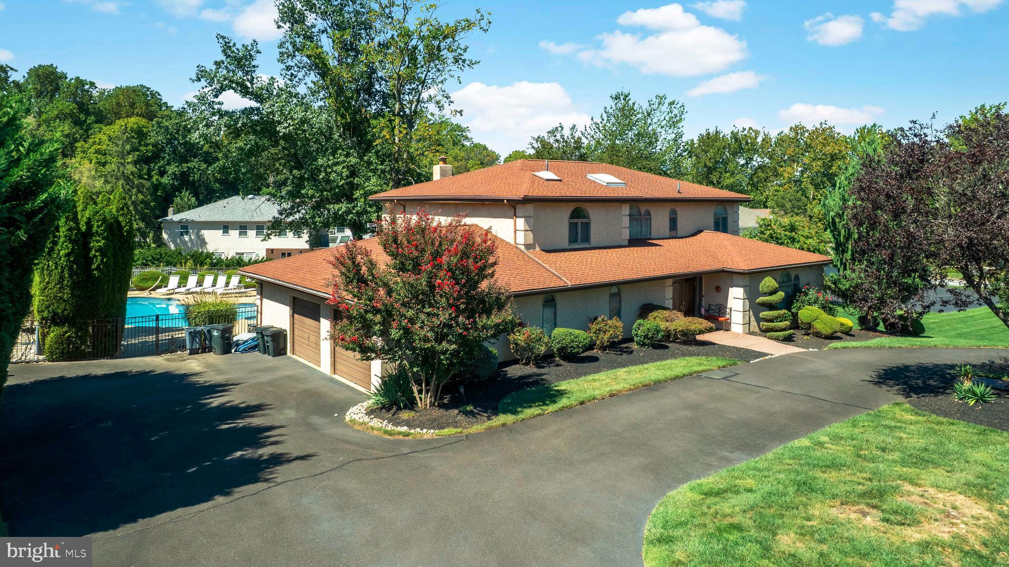 3843 Loop Road Huntingdon Valley, PA 19006 - Photo 3 of 51 a view of a house with yard and a garden