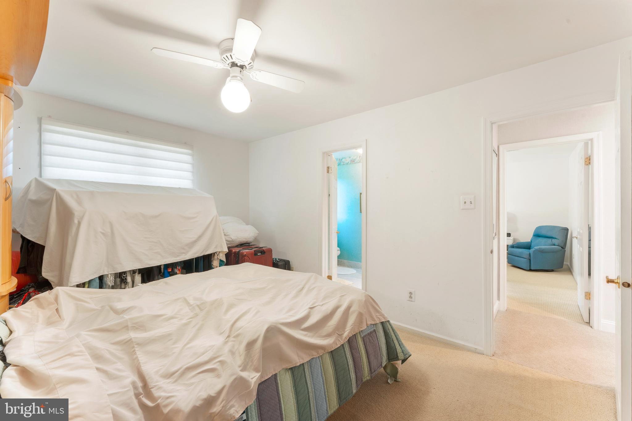 3843 Loop Road Huntingdon Valley, PA 19006 - Photo 35 of 51 a bedroom with a bed and a chandelier