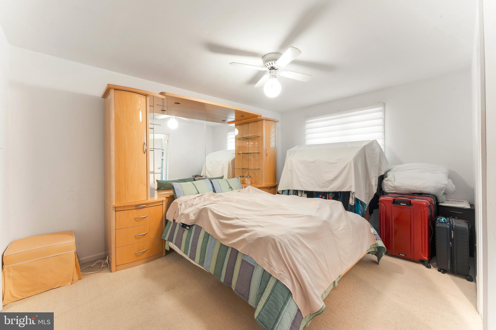 3843 Loop Road Huntingdon Valley, PA 19006 - Photo 36 of 51 a bedroom with a bed and a chandelier