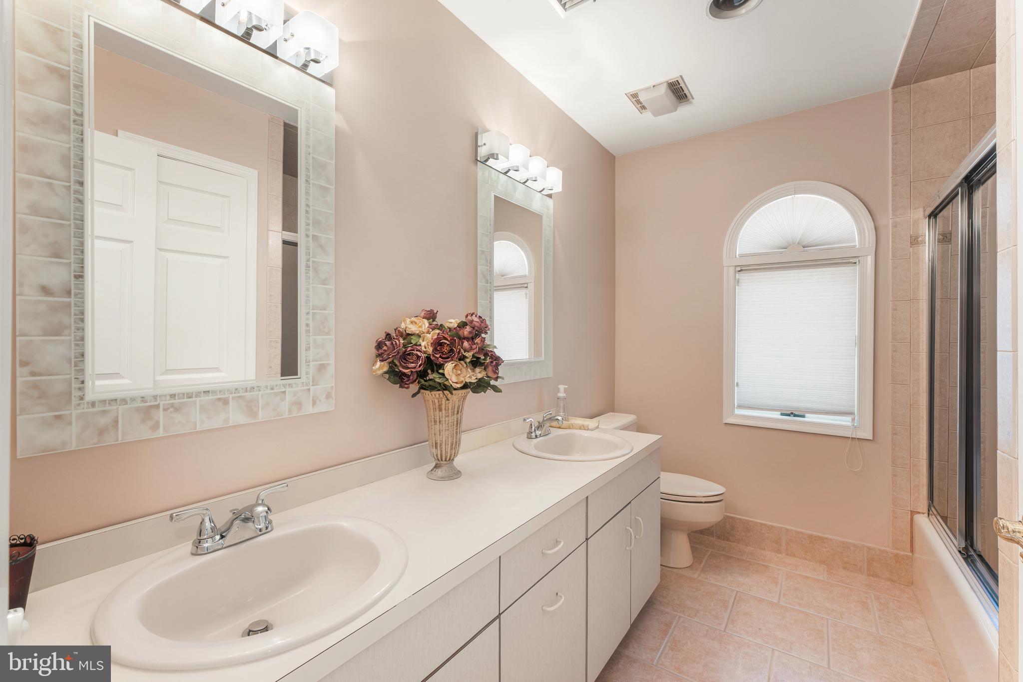 3843 Loop Road Huntingdon Valley, PA 19006 - Photo 37 of 51 a bathroom with a toilet sink and mirror