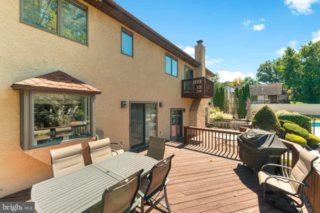 an aerial view of a house with yard swimming pool and outdoor seating