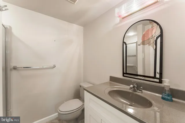 a room with furniture a book shelf and a book shelf