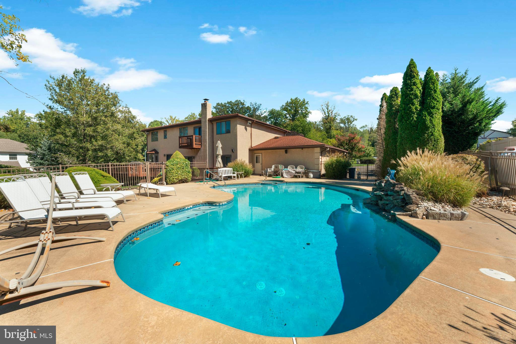 3843 Loop Road Huntingdon Valley, PA 19006 - Photo 49 of 51 a view of a swimming pool with a patio