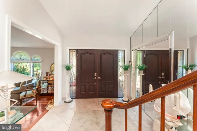 a view of an entryway with wooden floor