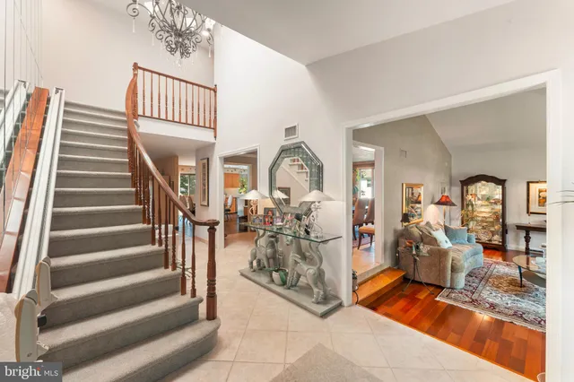 a view of a livingroom with furniture and staircase