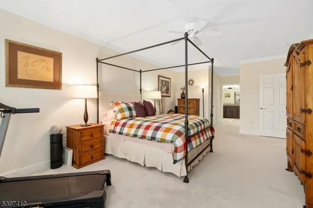 a bedroom with a bed lamp and window