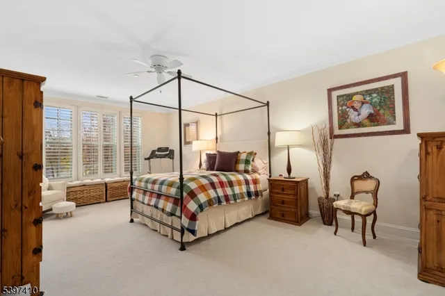 a bed room with a bed and a chair