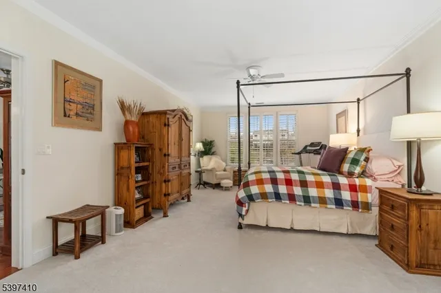 a living room with furniture and a lamp